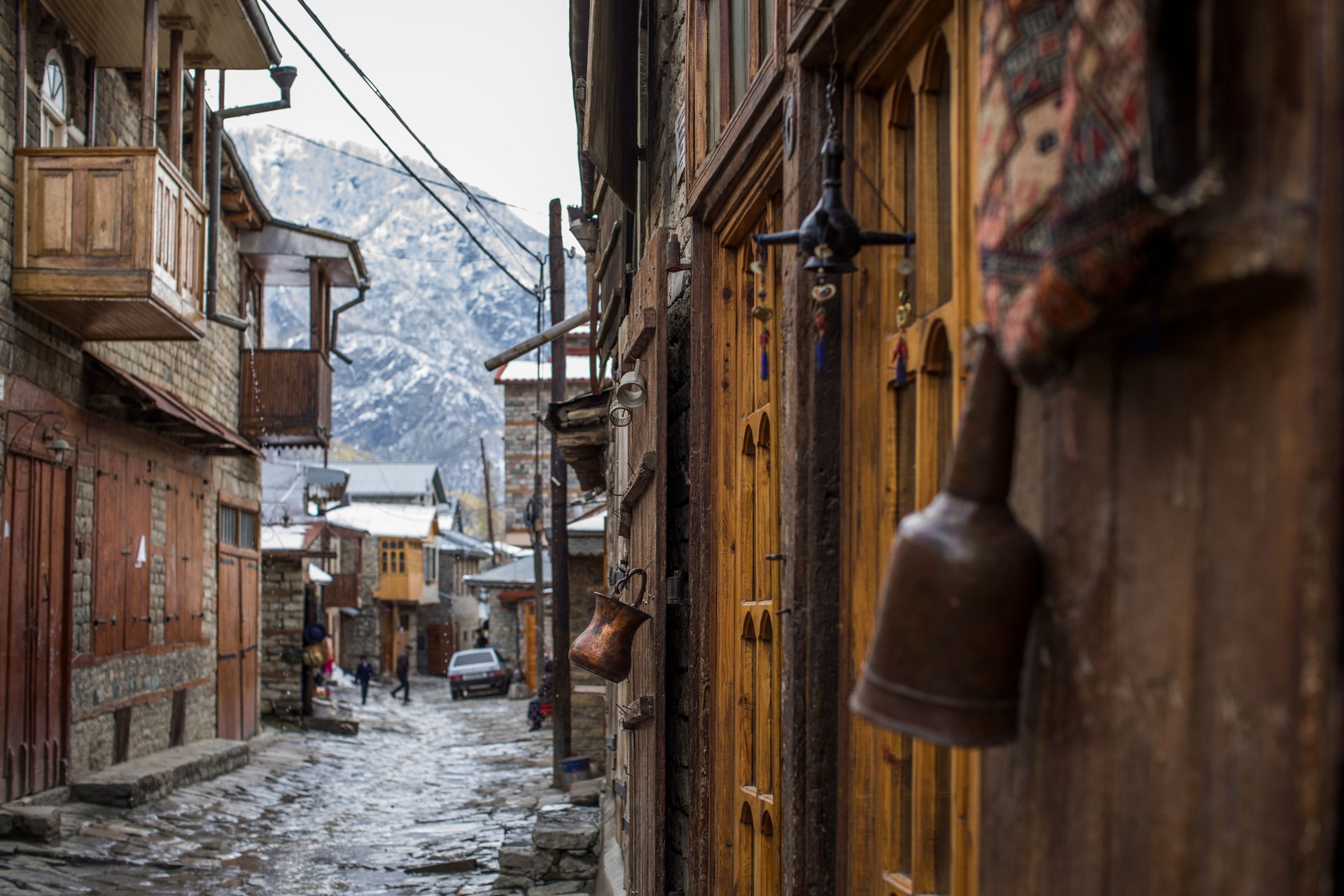 Cobblestone street with local people in Lahic.